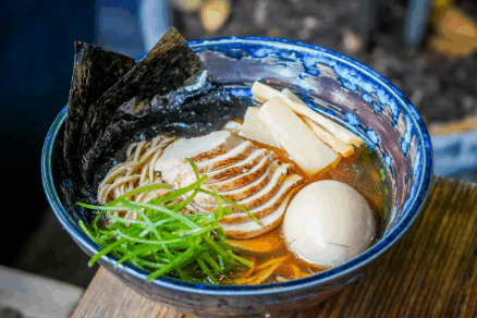 Maneki Ramen’s classic shoyu ramen — silky noodles in savory soy-based broth, topped with chashu pork, seasoned egg, bamboo shoots, nori, and fresh scallions.